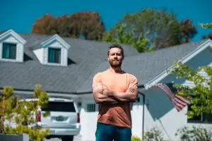 Business man outside near house, rent new home.